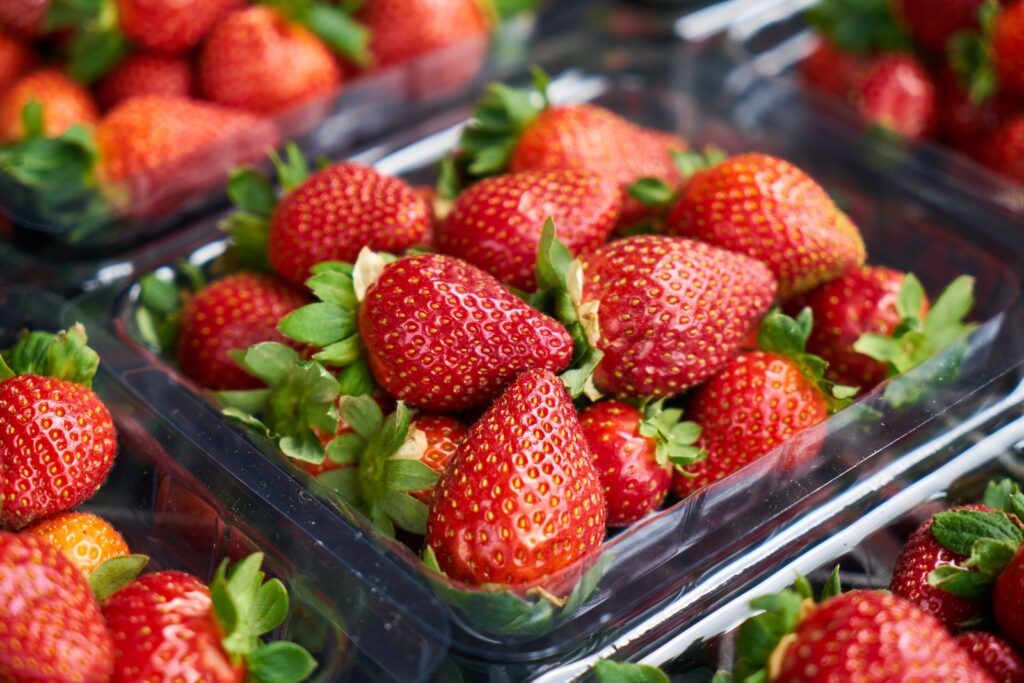 strawberries on clear plastic container